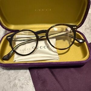 Authentic Gucci Black Round Eyeglasses with Purple Case.